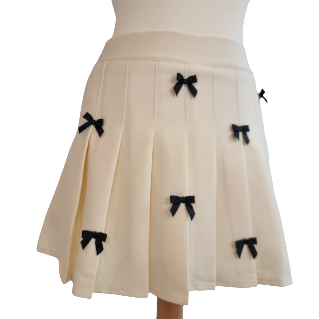 Cream Pleated Mini Skirt with Black Bow Accents