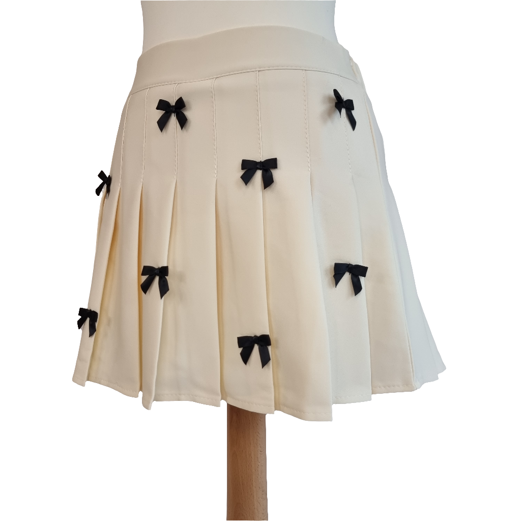 Cream Pleated Mini Skirt with Black Bow Accents