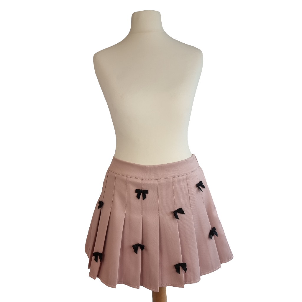 Blush Pink Pleated Mini Skirt with Black Ribbon Bow Accents