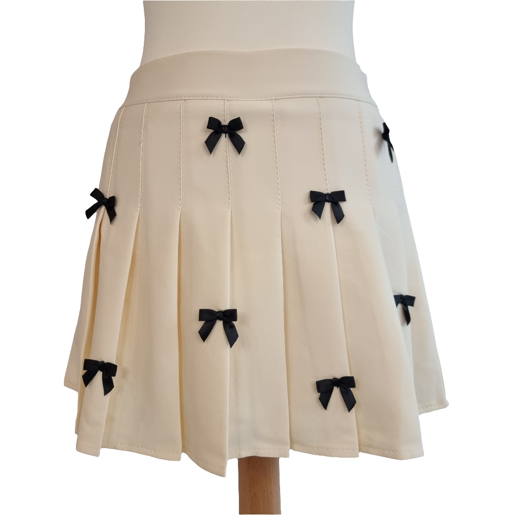 Cream Pleated Mini Skirt with Black Bow Accents