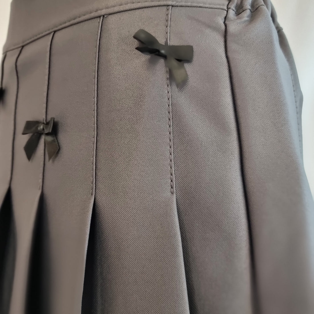 Charcoal Gray Pleated Mini Skirt with Black Bow Details